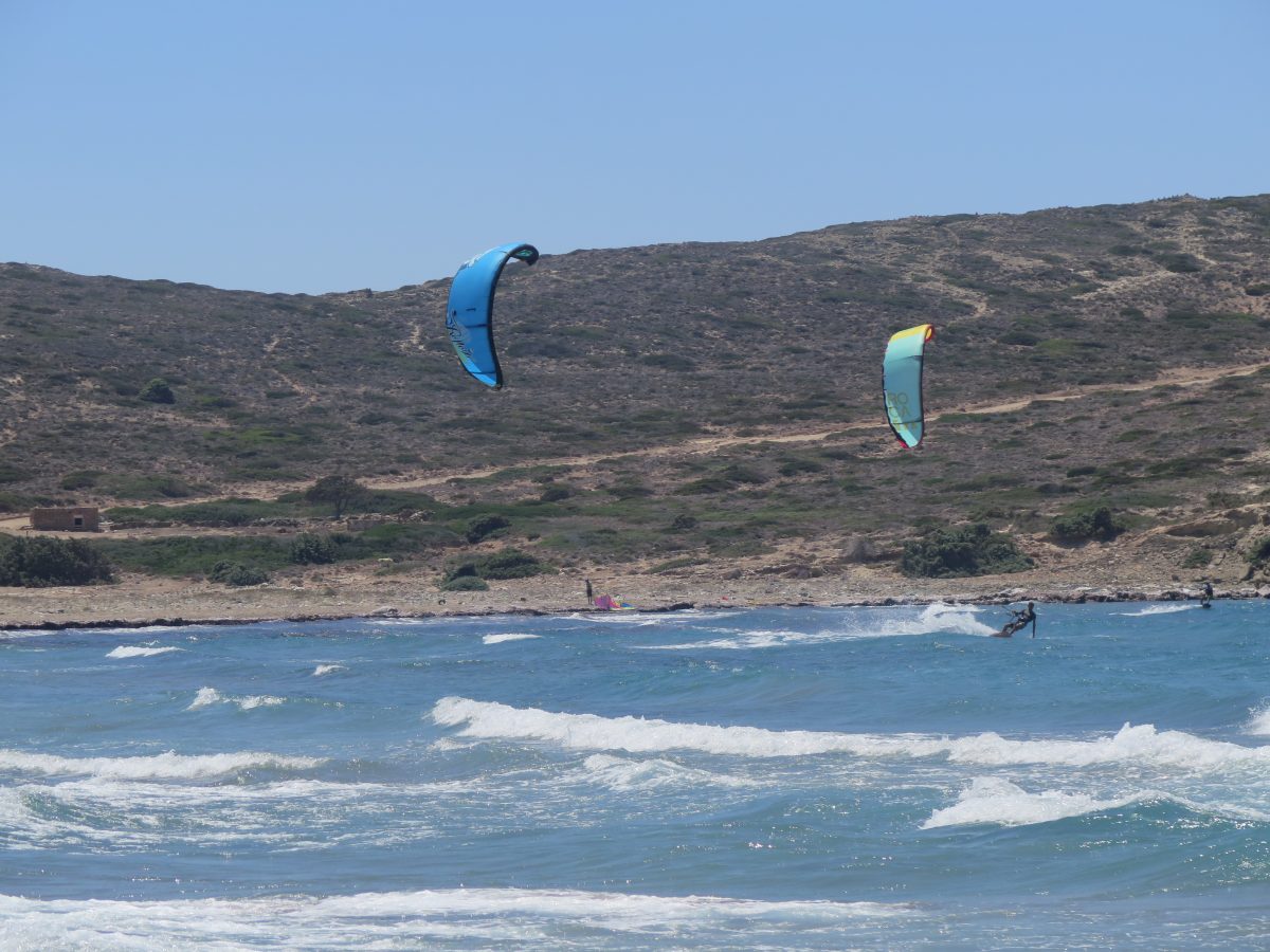 Prasonisi beach Rhodes with 2 kitesurfers