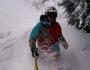 Skier in waist deep powder in Saalbach. Freeride Saalbach